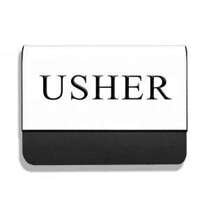 White pocket name tag with USHER engraved on it in capital letters