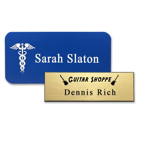 Plastic blue and gold name tags with engraved logos and text.