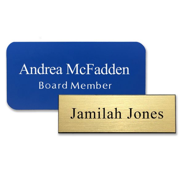 Plastic blue and gold name tags with engraved names, titles, and text.