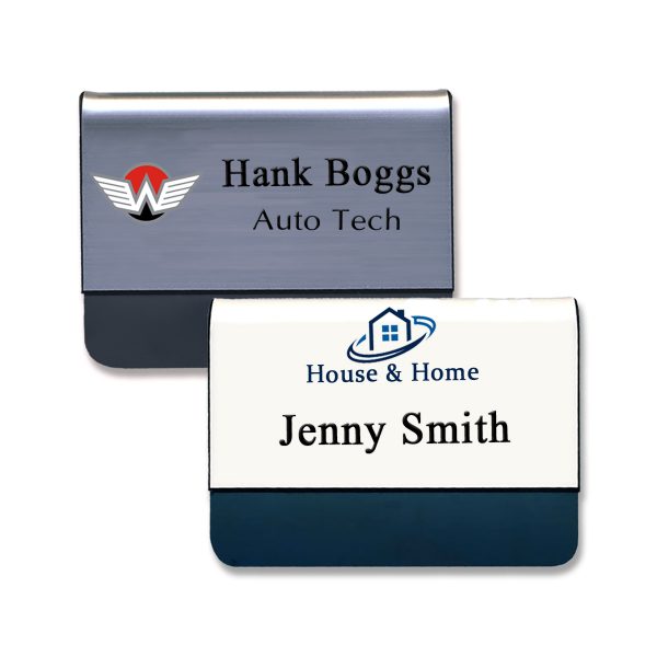 Silver and white pocket name tags with black tongues and engraved text with full color printed logos.