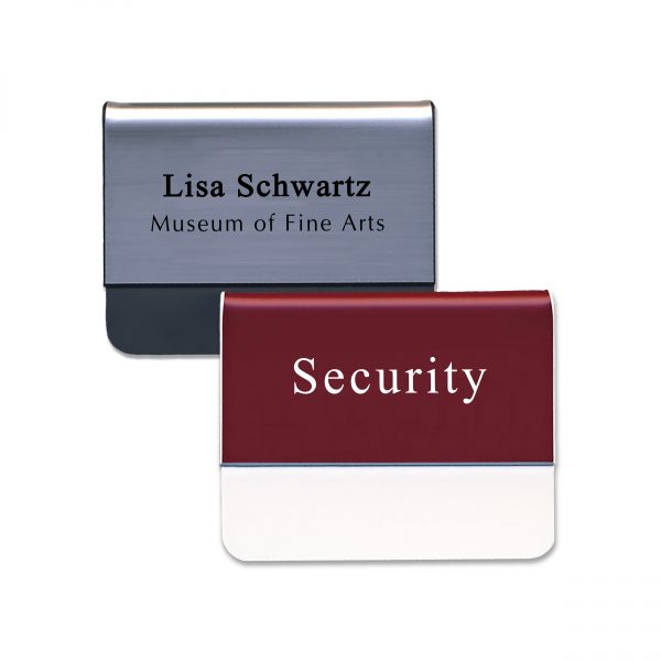 Silver and red plastic pocket name tags with engraved text.