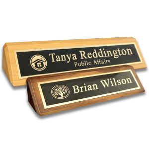 Alder desk wedges with laser engraved metal name plates with lines of text and company logo.