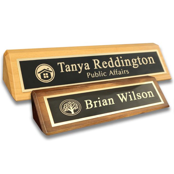 Alder desk wedges with laser engraved metal name plates with lines of text and company logo.