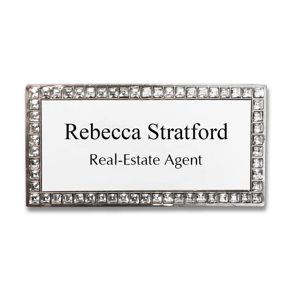 Name tags with rhinestone border and white acrylic face with printed text.